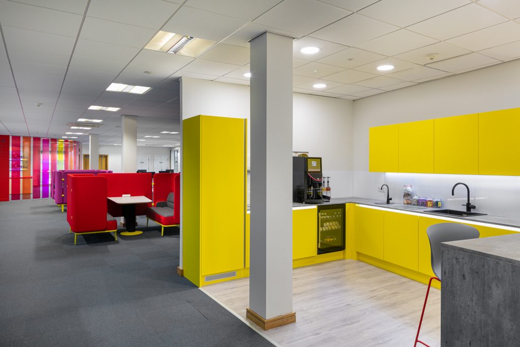 Drop-in office space with bright colourful kitchen and furniture