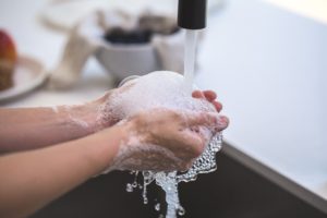 A worker washing their hands